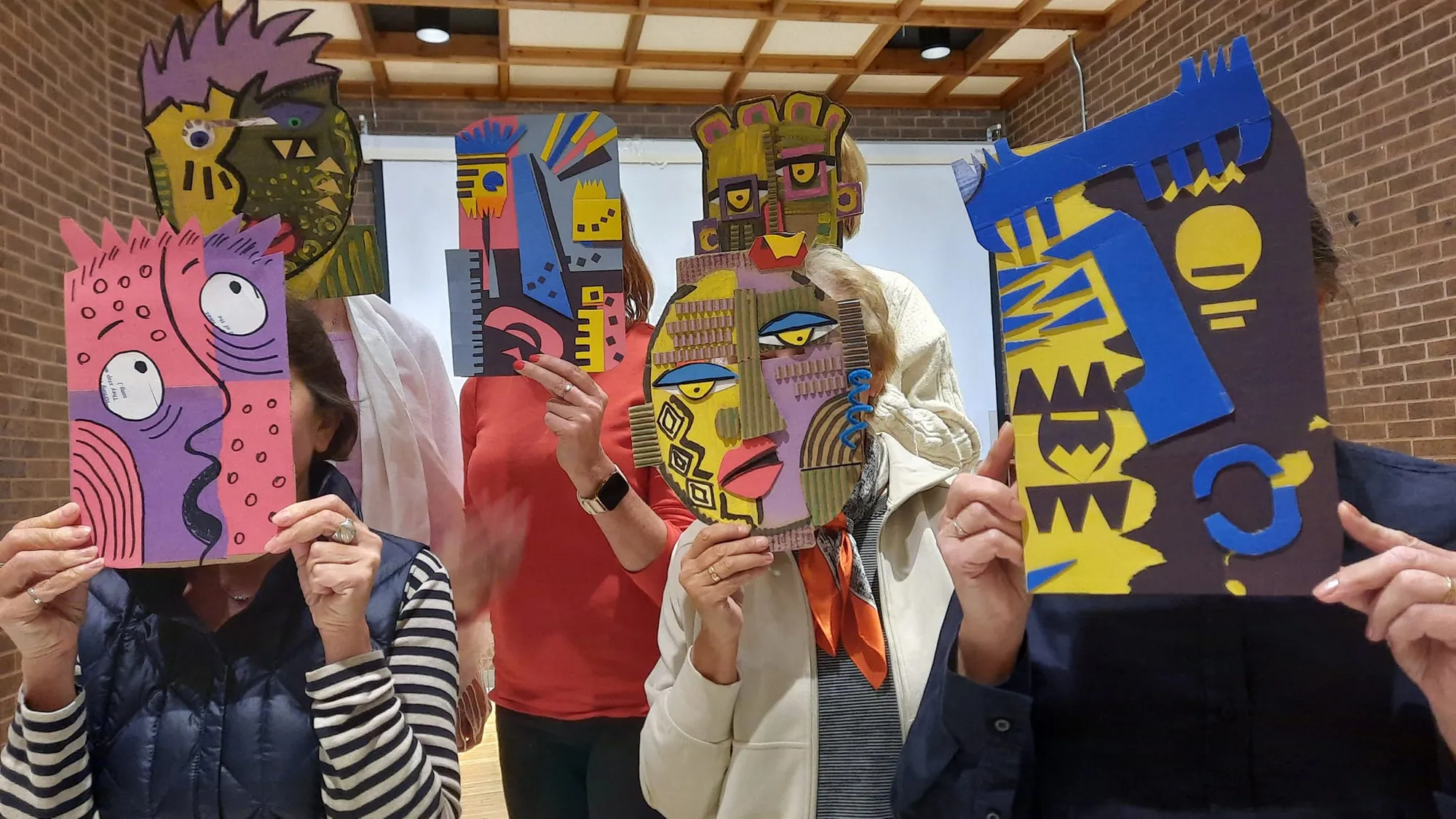 Children making colorful masks at the workshop