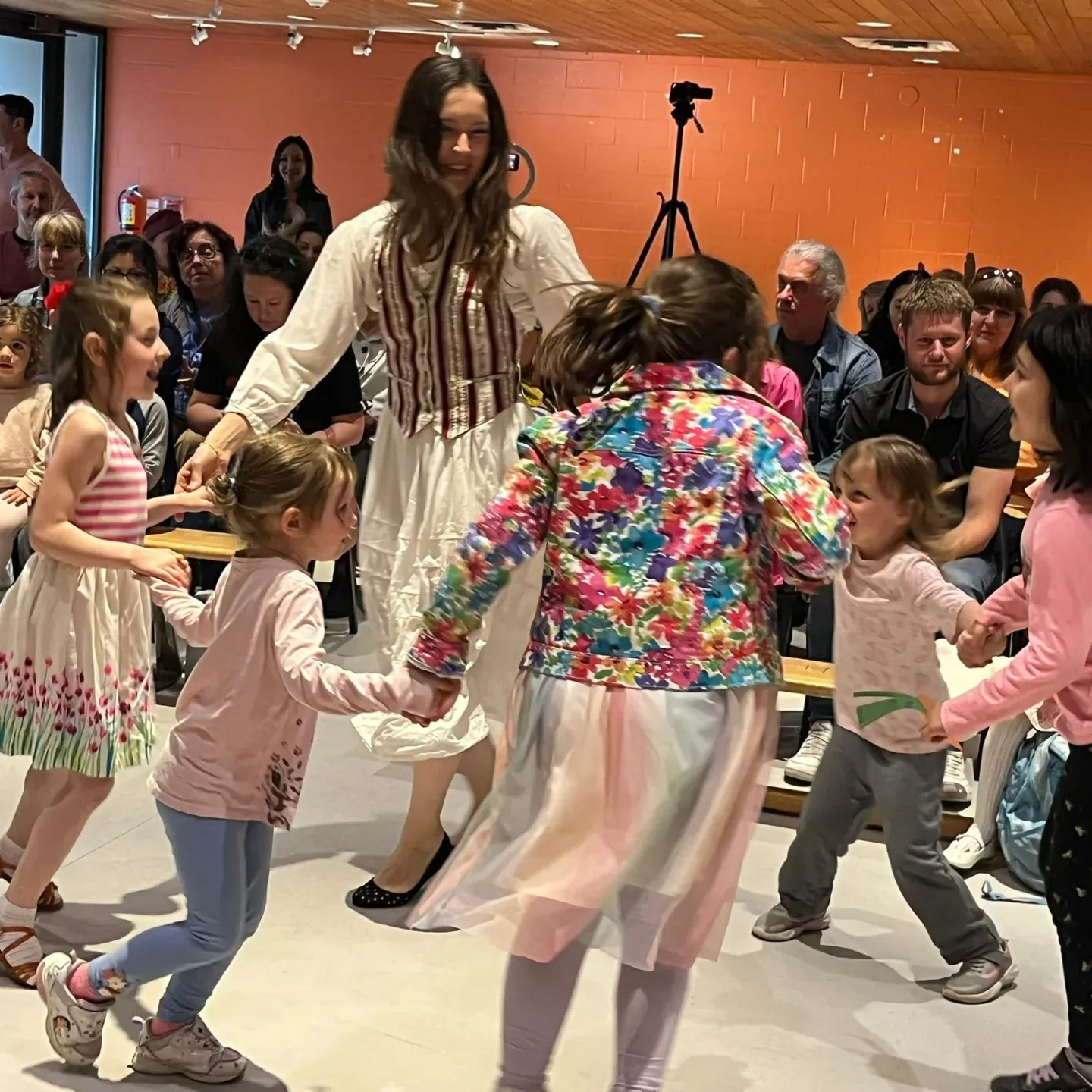 Children dancing in circles during the Sol Festival Jewish culture celebration